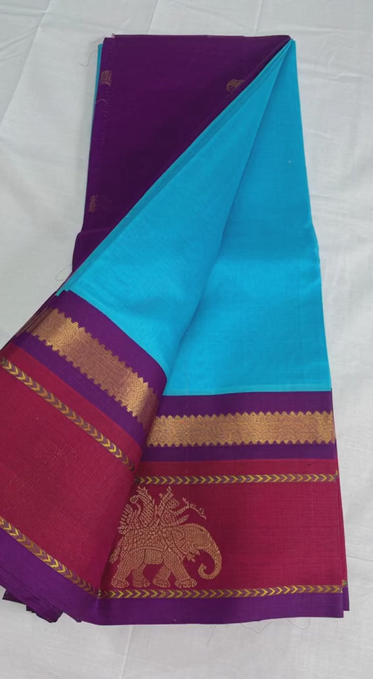 Light blue Silk cotton saree with red and purple korvai zari border